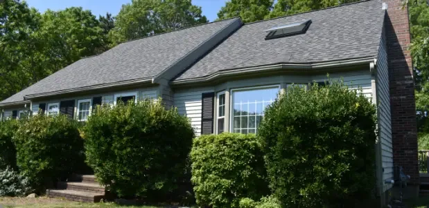 Cape Cod house with a repaired roof and skylight