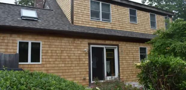 Cedar-shingled home with a replaced roof and skylights